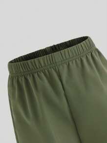 SHEIN Conjunto de 2 piezas para niñas preadolescentes con camiseta de cuello redondo de manga corta de unicolor y pantalones largos utilitarios