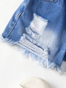 年轻女孩新款休闲时尚斜襟蓝色洗水牛仔短裤