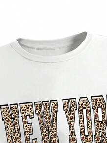 SHEIN Conjunto de 2 piezas para niñas preadolescentes con camiseta de cuello redondo de manga corta de unicolor y pantalones largos utilitarios