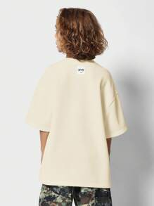 SUMWON Oversized Drop Shoulder T-Shirt With Minimal Text Detail Urban Streetwear Essential Youth Fashion Comfortable Relaxed Fit Casual Summer Top - Yellow - View 2