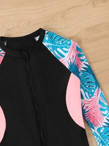 SHEIN 少女新款春夏季泳衣，黑色拼色设计搭配粉色侧面撞色，热带花卉和树叶印花，长袖连体泳衣，防晒，适合游泳、度假、冲浪、运动装风格，少女运动泳衣