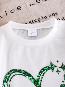 SHEIN Camiseta de manga corta de punto de niña en color marfil, Camiseta informal de niña con estampado de trébol de la suerte y corazón, Verano