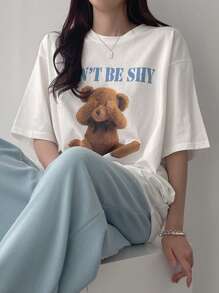 DAZY T-shirt femme ample d'été à imprimé ours de dessin animé avec col rond et épaules tombantes. "N'AYEZ PAS PEUR S'IL VOUS PLAÎT FAITES-MOI ME SENTIR SEUL" Hauts mignons Oversize T-shirt