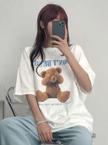 DAZY T-shirt femme ample d'été à imprimé ours de dessin animé avec col rond et épaules tombantes. "N'AYEZ PAS PEUR S'IL VOUS PLAÎT FAITES-MOI ME SENTIR SEUL" Hauts mignons Oversize T-shirt