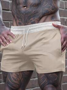 Manfinity Homme Pantalones cortos casuales con cordón en la cintura de corte holgado para hombres, ropa de hombre