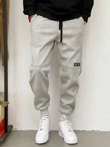 Manfinity Dauomo Pantalones casuales de hombre con cordón de color liso, de moda y sencillos