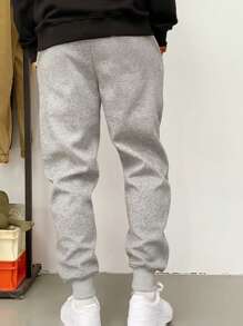 Manfinity Dauomo Pantalones casuales de hombre con cordón de color liso, de moda y sencillos