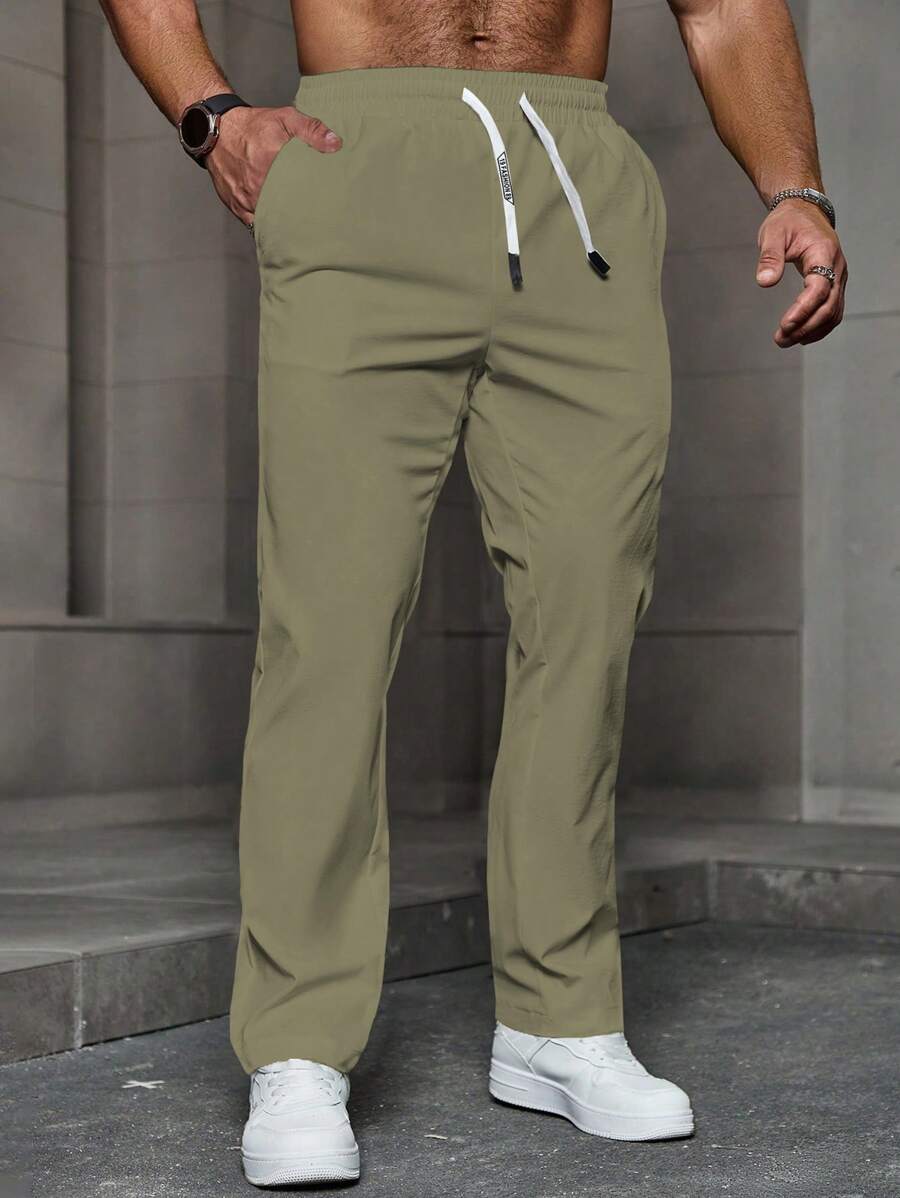 Manfinity Homme Quần ống đứng dáng rộng màu trơn có dây rút eo dành cho nam, mùa thu - xanh quân đội - Xem 1
