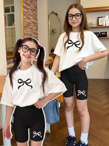 SHEIN Leap Crew Set de 2 piezas de outfit de verano para adolescentes, con blusa de manga corta de cuello redondo con estampado de moño - Multicolor - Ver 1