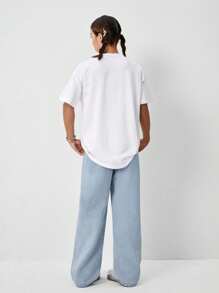 Set de 2 piezas: Camiseta holgada con lazo estampado y jeans de pata ancha bordados para niñas preadolescentes, ropa diaria cómoda y de moda - Blanco - Ver 2