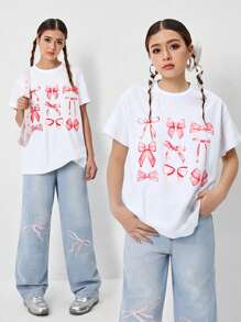 Set de 2 piezas: Camiseta holgada con lazo estampado y jeans de pata ancha bordados para niñas preadolescentes, ropa diaria cómoda y de moda - Blanco - Ver 1