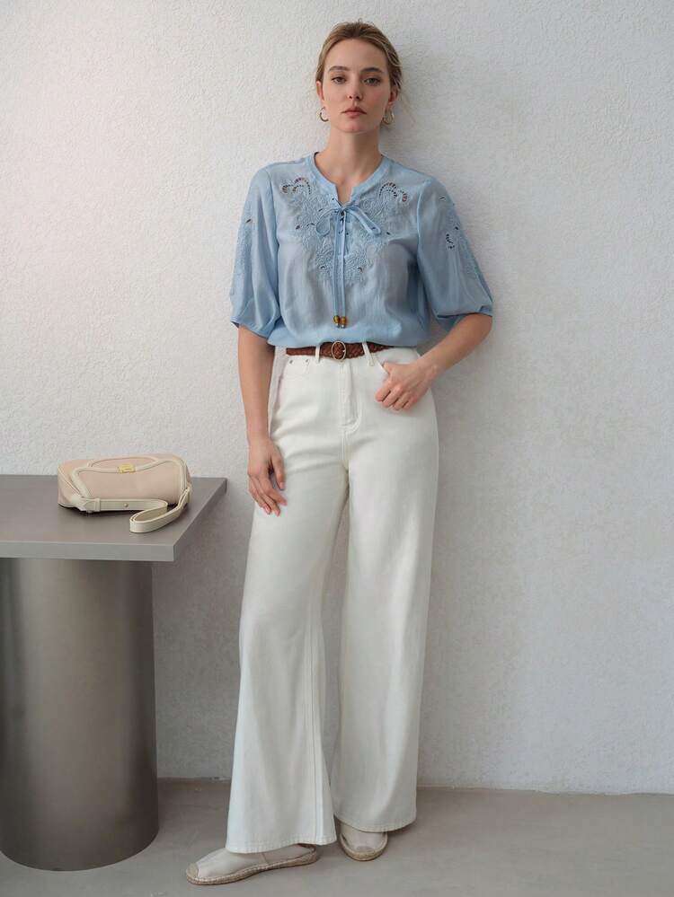 Blusa con applicazioni e collo con fiocco