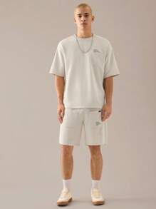 Manfinity VCAY 2 pièces Ensemble t-shirt à manches courtes décontracté lâche en tricot et short à taille élastique à jambe droite pour hommes