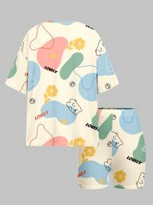 SHEIN Set de 2 piezas con camiseta de manga corta y shorts con estampado de grafiti y dibujos animados para niña preadolescente, adecuado para el verano