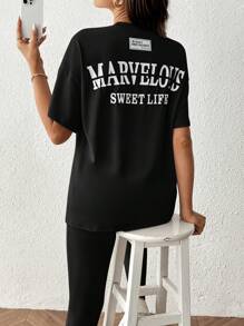 SHEIN 2 件套：孕妇休闲字母印花圆领落肩宽松 T 恤和紧身裤 - 黑色 - 查看 2