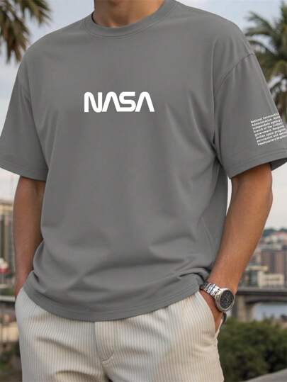 Manfinity Homme 2025 Wiosna i Lato Nowy Plus Size Męski T-shirt z okrągłym dekoltem i krótkim rękawem, Minimalistyczny swobodny Wygodny Premium Jasnoszary/Biały Nadruk liter Uniwersalny