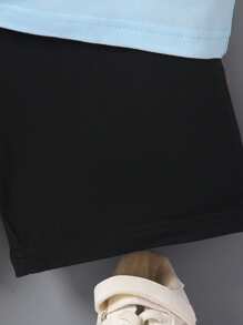 SHEIN Young Boy 2pcs Yellow Knitted Striped Print T-Shirt And Black Casual Knitted Sports Shorts Set For Summer