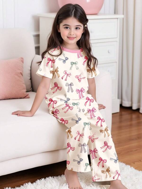 SHEIN Young Girls Casual Minimalist Pink Bow Graphic Round Neck Short Sleeve T-Shirt & Loose Long Pants Homewear Set, Suitable For Spring/Summer