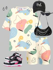 SHEIN Set de 2 piezas con camiseta de manga corta y shorts con estampado de grafiti y dibujos animados para niña preadolescente, adecuado para el verano