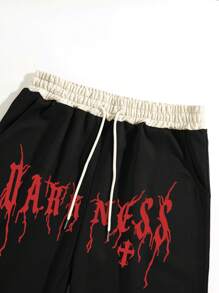 Manfinity EMRG 男士宽松十字架和字母图案抽绳腰部运动裤街头潮流服饰，适合狂欢