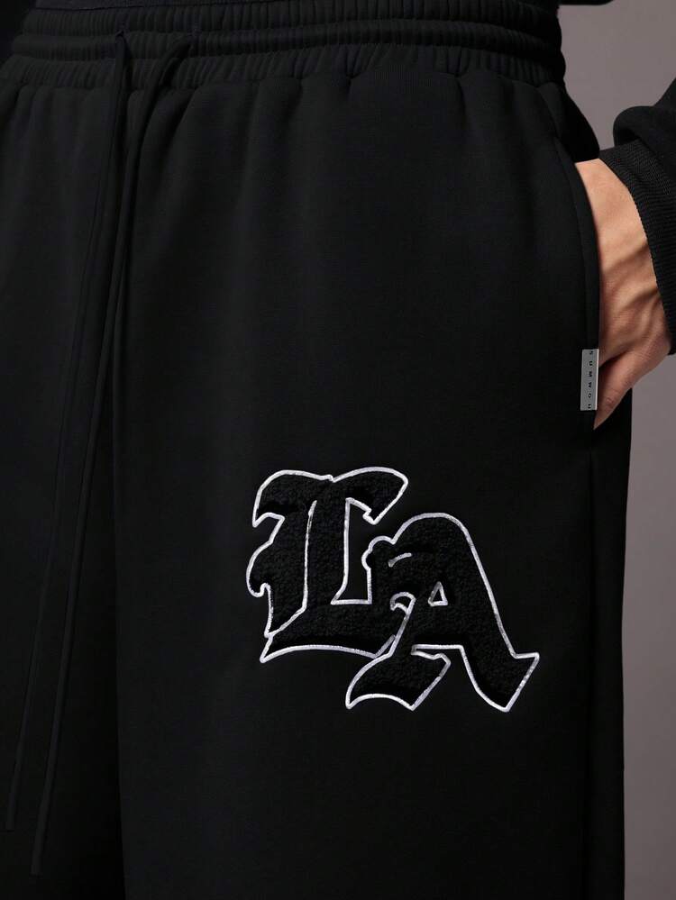 SUMWON ドロップクロッチジョガーパンツ フリース ストリートウェア ロゴ刺繍 伸縮性リブ裾 快適ラウンジ ウィンターパンツ カジュアルアーバンスタイル