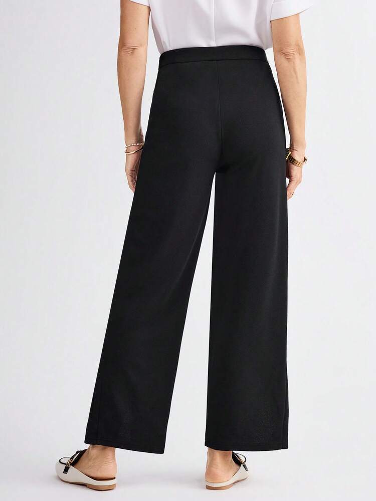 女性用カジュアル ブラック スリムフィットパンツ サイドポケット付き ボタンデザイン