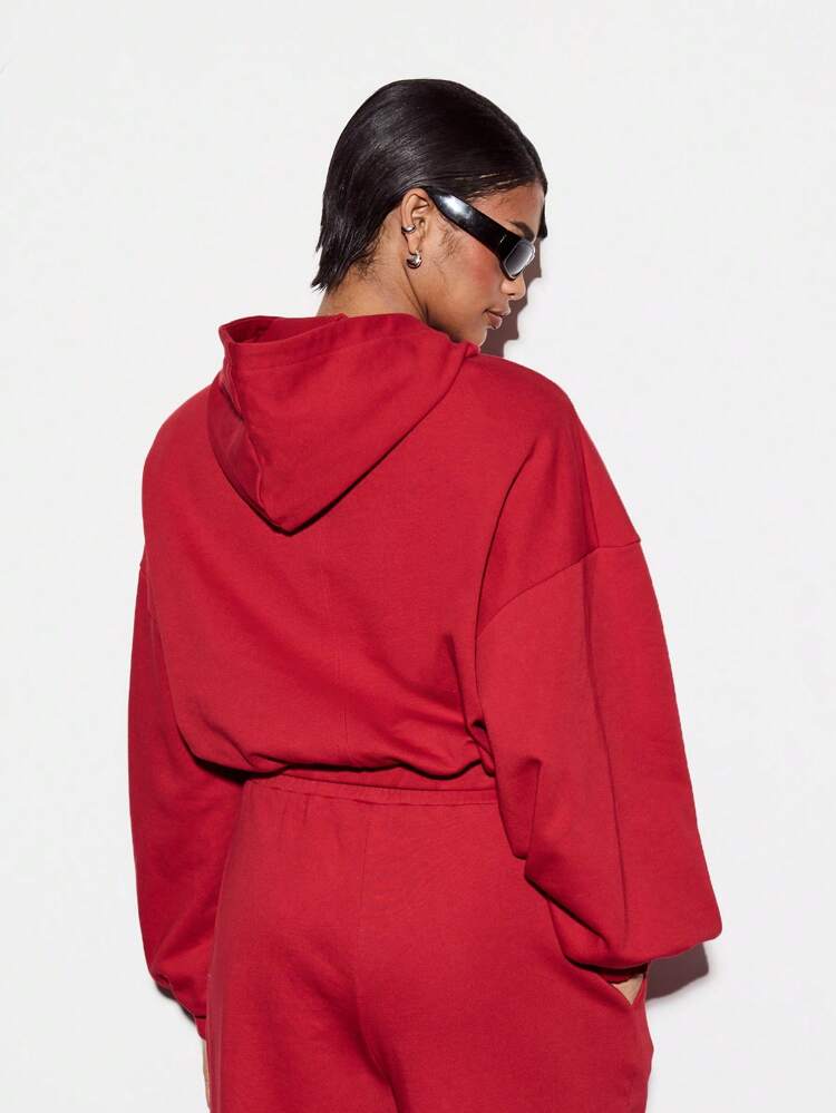 KIZN sweat-shirt à capuche avec logo et manches ballons