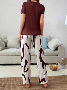 SHEIN Conjunto de pijama de mujer con estampado informal, de manga corta y pantalón