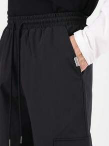 SUMWON Skater Fit Nylon Cargo Pants With Elastic Ankle, Drawstring Waist, Relaxed Fit Streetwear For Winter Sports And Urban Fashion, Versatile Travel Pants - Black - View 8