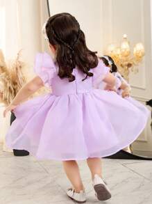 Elegantes kurzes Baby Mädchen Kleid mit Organza Rüschensaum, einfarbig, kurzärmelig, Magenta