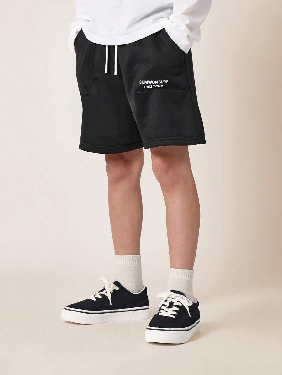 SUMWON Pantalones cortos deportivos con cordón para jóvenes, cómodos de felpa, para entrenamiento deportivo, gimnasio, baloncesto, casual, verano, running, entrenamiento activo - Negro - Ver 1