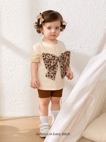 Cozy Pixies 女婴两件套蝴蝶结装饰圆领短袖上衣和松紧腰裤