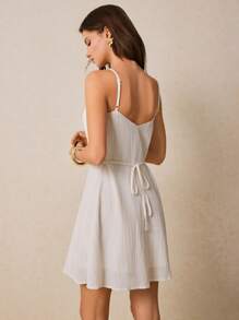 Poéselle Vestido mini estilo línea-A con botones encantadores en color blanco - Perfecto para días soleados y salidas casuales, vestidos de línea-A para mujeres, vestidos de verano para mujeres, vestidos blancos, vestidos para playa de mujeres, vestidos casuales de día, vestidos ligeros de día, vestidos mini con top de tirantes, vestido de verano, vestidos de verano para mujeres, vestido de graduación blanco
