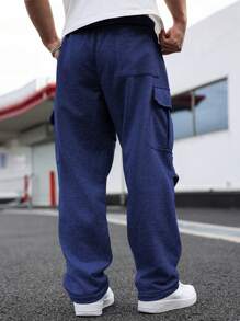 Manfinity Homme Spodnie dresowe męskie w jednolitym kolorze, kieszenie cargo, plisowane, szerokie nogawki, plus size