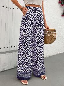 EURMUSE Boho Ikat-Print Wide-Leg Pants - Blue & White | Elevate Your Summer Style With These Striking Ikat-Print Pants, Featuring A Relaxed Wide-Leg Fit And Lightweight, Airy Fabric For Ultimate Comfort. Perfect For Beach Days, Vacations, Or Adding A Pop Of Color To Your Everyday Wardrobe, These High-Waist Pants Combine Bold Patterns With Effortless Elegance - Blue - View 4