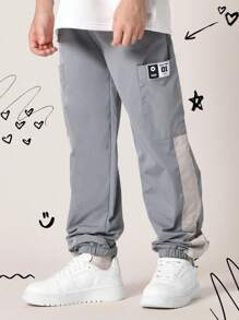 SUMWON 弹性裤脚运动裤，运动性能尼龙慢跑裤，带实用口袋，侧面板细节，街头风格，青少年训练裤 - 灰色 - 查看 1