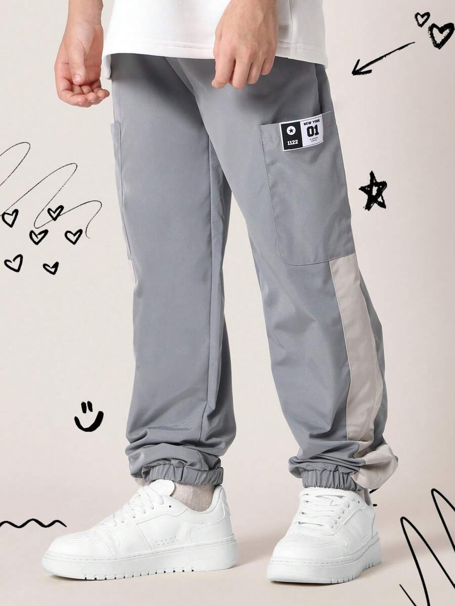 SUMWON 弹性裤脚运动裤，运动性能尼龙慢跑裤，带实用口袋，侧面板细节，街头风格，青少年训练裤 - 灰色 - 查看 1