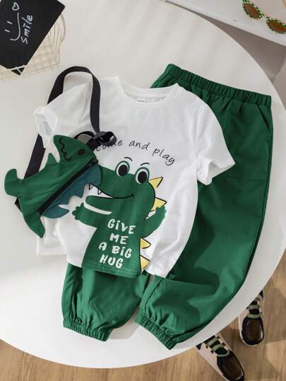 SHEIN Conjunto de ropa de verano para niño pequeño: Camiseta de manga corta con estampado de dinosaurios, pantalones con cordón tejido, bolso bandolera con forma de dinosaurio. Cómodo y adecuado para jugar al aire libre, fiestas y uso diario.