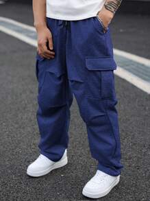Manfinity Homme Spodnie dresowe męskie w jednolitym kolorze, kieszenie cargo, plisowane, szerokie nogawki, plus size
