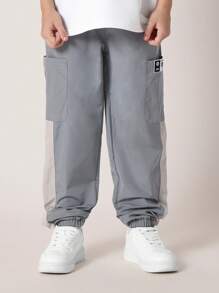 SUMWON 弹性裤脚运动裤，运动性能尼龙慢跑裤，带实用口袋，侧面板细节，街头风格，青少年训练裤 - 灰色 - 查看 2