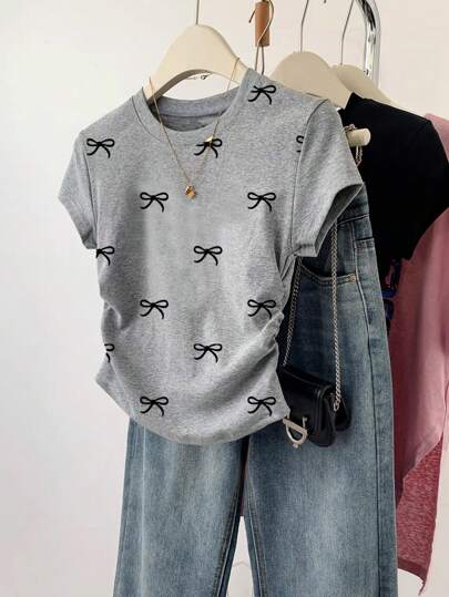 SHEIN Explorewe Teen Girl Simple All-Over Bowknot Print Waist-Cinched Short Sleeve T-Shirt, Versatile