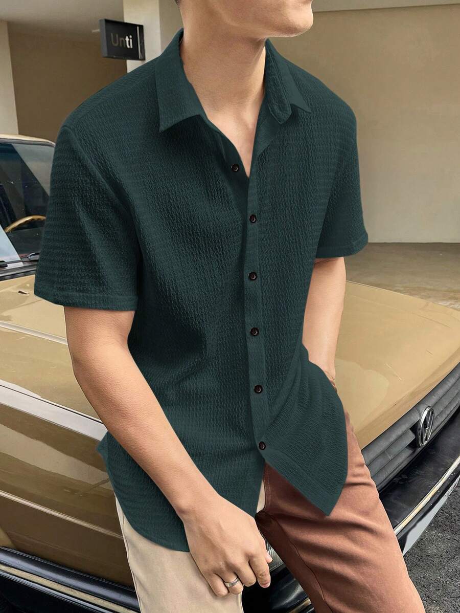 Manfinity Homme Camisa informal holgada de manga corta con botones de un solo color para hombres