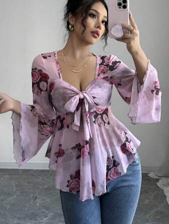 Rafferiza Camiseta de mujer estilo Ibiza de manga larga con volantes, bajo asimétrico, diseño floral, lazo y transparencia, con estilo casual y sexy para vacaciones