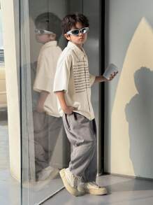 2pcs/Set Tween Boys' Casual Korean Style Letter & Graphic Print Short Sleeve Polo Shirt And Loose Woven 3/4 Pants Outfit