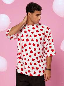 Manfinity VCAY Camiseta de manga corta unisex de corte holgado, cuello redondo y hombros caídos con estampado de pequeños corazones en todo el diseño