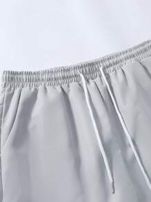 Manfinity RSRT 2 pezzi Completo estivo casual da uomo con camicia a maniche corte con stampa patchwork e pantaloni lunghi monocromatici