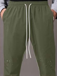 SUMWON Sporty Athletic Paint Splatter Track Pants Streetwear Flared Leg Training Workout Performance Bottoms Fall Winter Fashion Statement Piece - Army Green - View 6