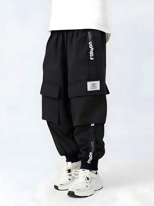 SHEIN Genkimix Kids Pantalones cargo juveniles de moda con bolsillo 3D, cinta lateral, puños elásticos, adecuado para niños de 4 a 7 años, primavera/verano/otoño