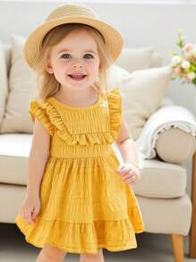 Váy mùa hè tay ngắn viền bèo nhún màu vàng cho bé gái, sử dụng màu vàng tươi tắn tự nhiên làm màu chủ đạo, dễ dàng phù hợp với không khí kỳ nghỉ hè, ngọt ngào và tràn đầy sức sống. - Màu vàng - Xem 1