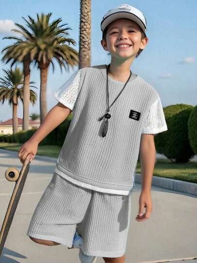 SHEIN Sparklyn 2pcs/Set Teen Boy Sleeveless Minimalist Logo Shirt And Shorts Set